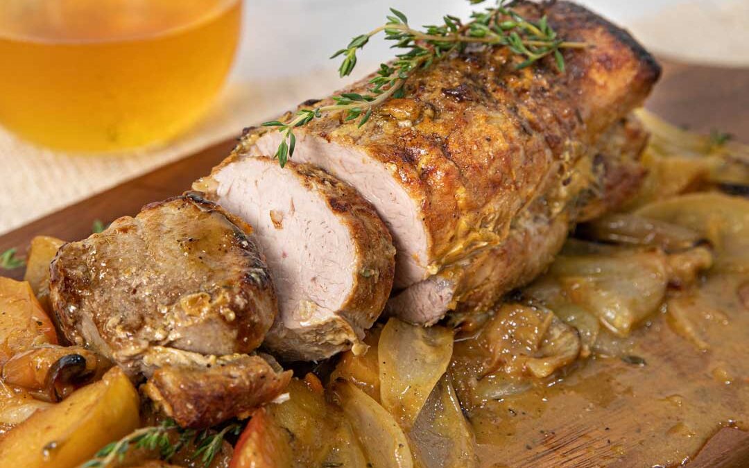 Succulent Roast Pork Tenderloin on a bed of onions and apples